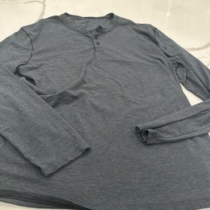 Lululemon. Men’s dark gray, long sleeved, 3 button down shirt.  Good condition.